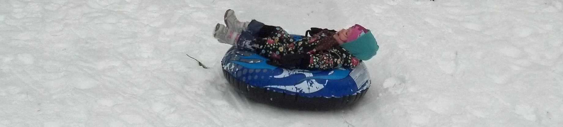 Nia pilots the Snow Tube. Courtesy of Rick Sherin.