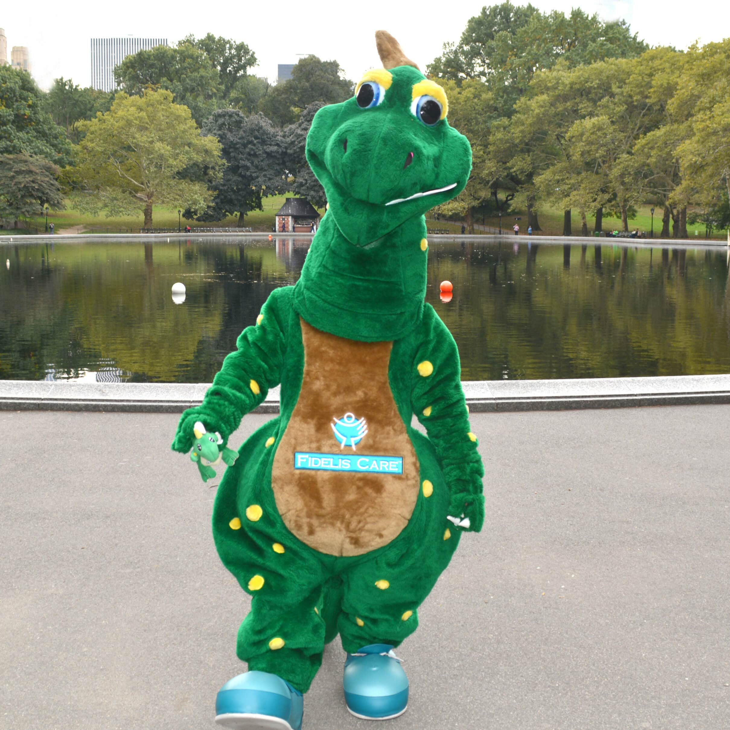 Fidelis Care Dinosaur standing by a pond