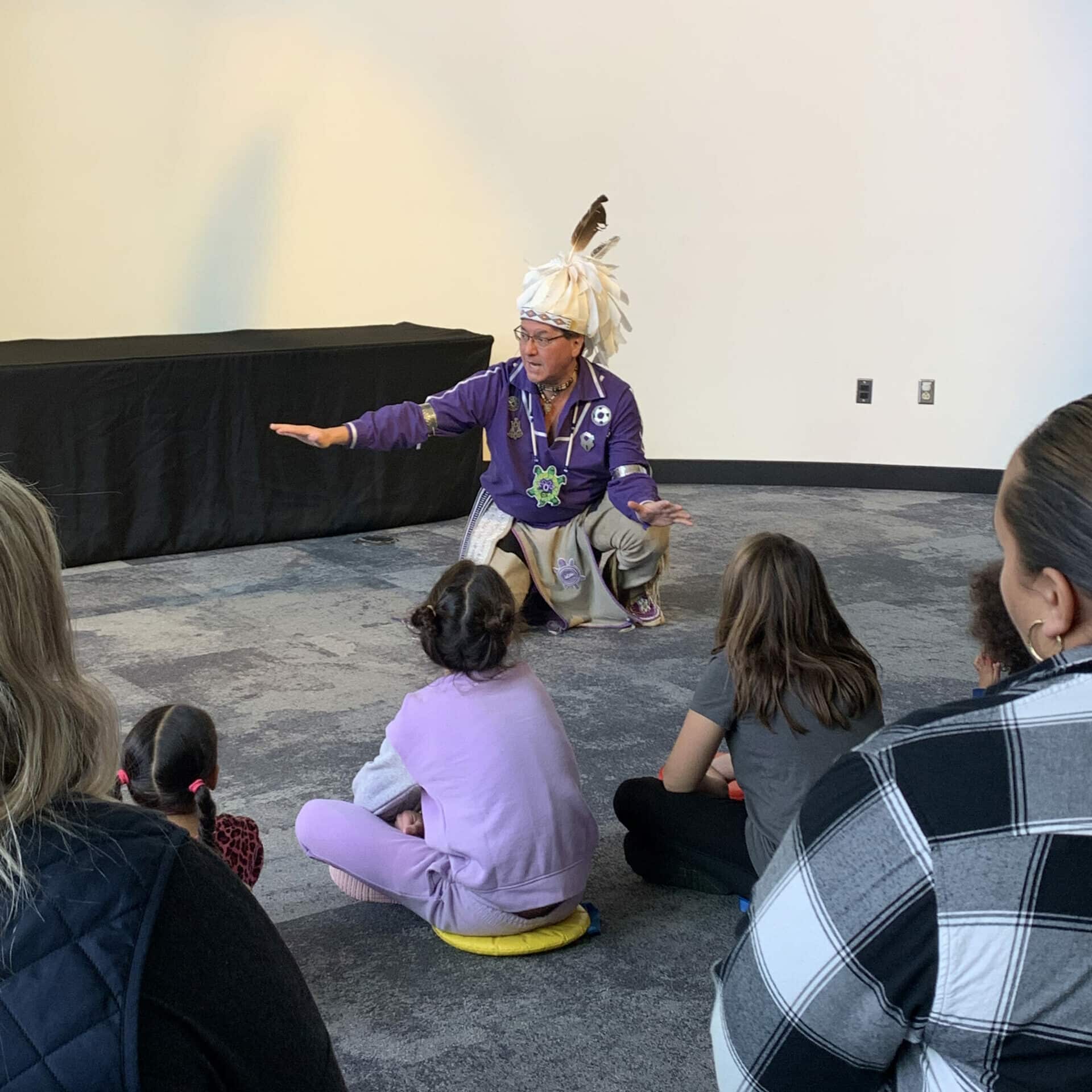 Man telling a story to kids