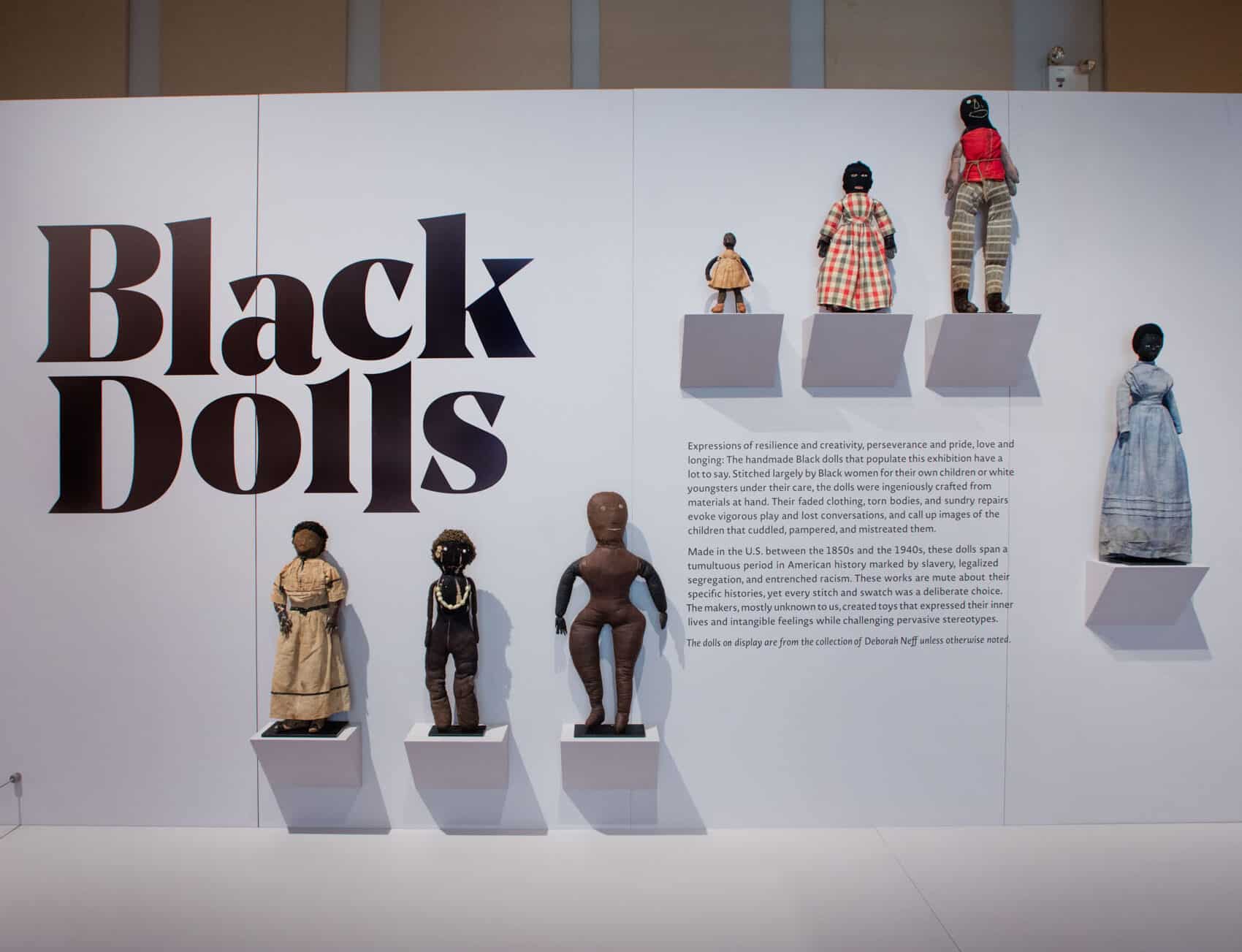 Black Dolls logo with 7 dolls