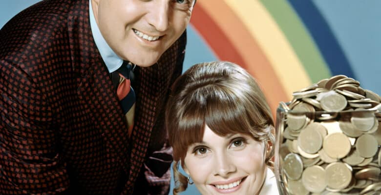 Monty Hall and Carol Merrill posting with a pot of gold