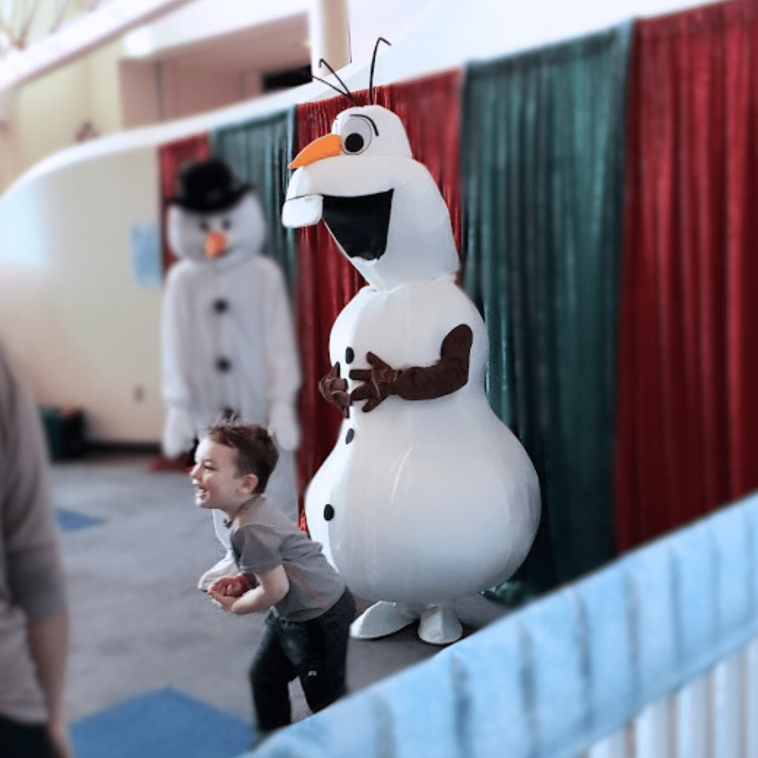 Person in Olaf costume from Frozen meeting a kid