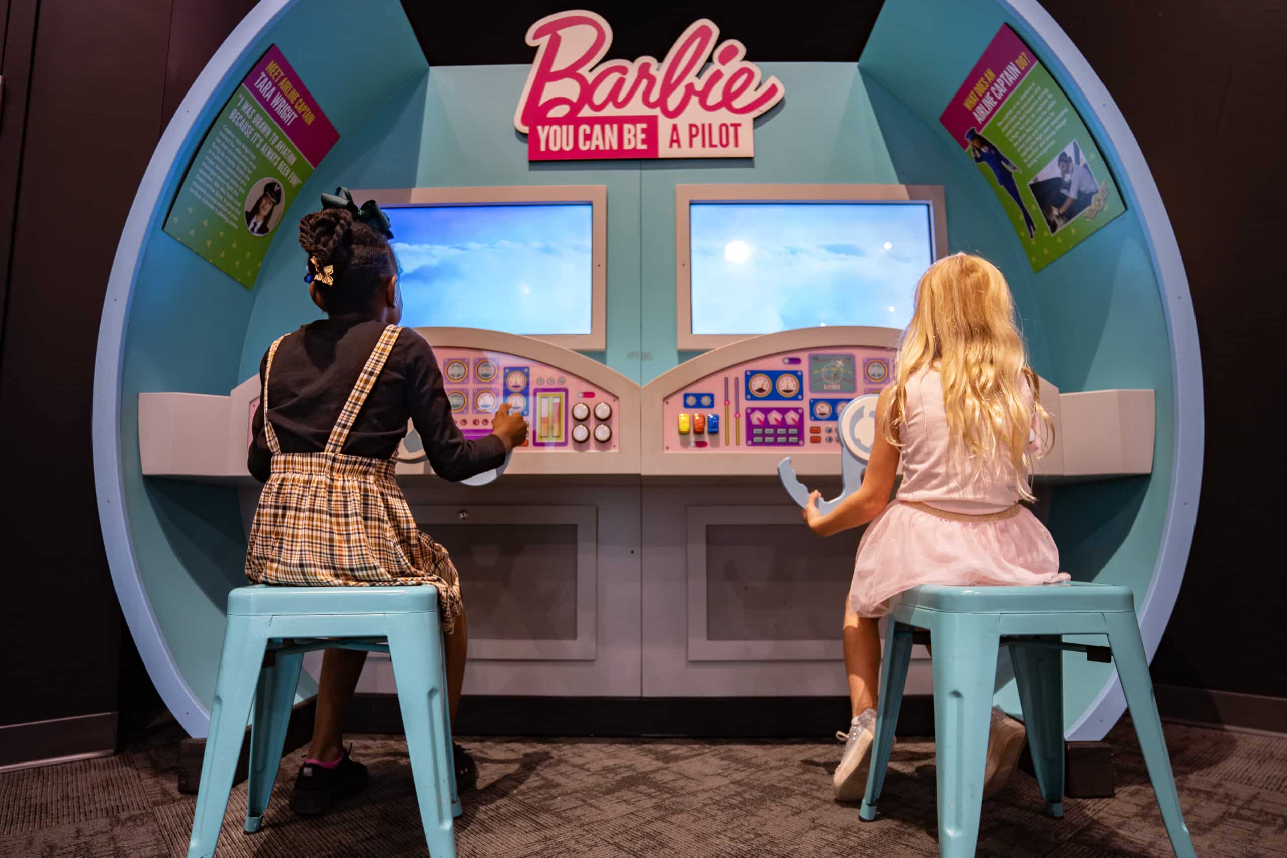 two girls playing barbie you can be a pilot