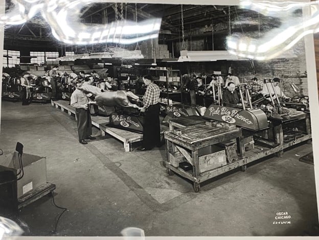 Image of Workers assembling Big Bronco kiddie ride inside of Exhibit Supply Co., Chicago, IL, about 1940s-1950s.
Larry Bieza collection, Brian Sutton-Smith Library and Archives of Play at The Strong National Museum of Play, Rochester, New York.
