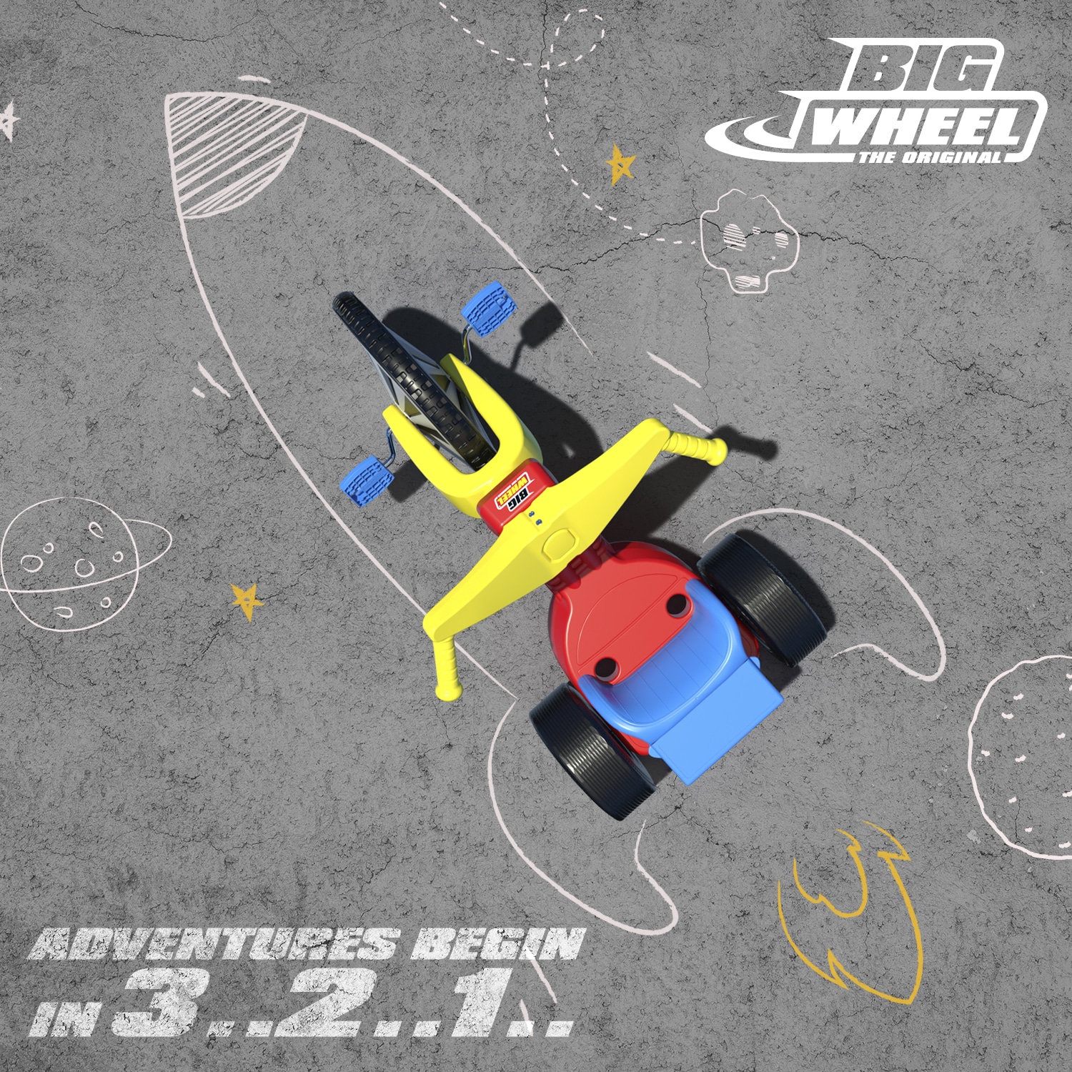 Big Wheel on pavement with a chalk drawing of a rocket ship.